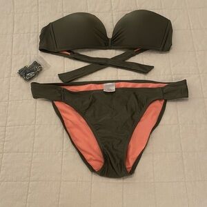 Dark green swim suit. Medium top, large bottom. Good condition.